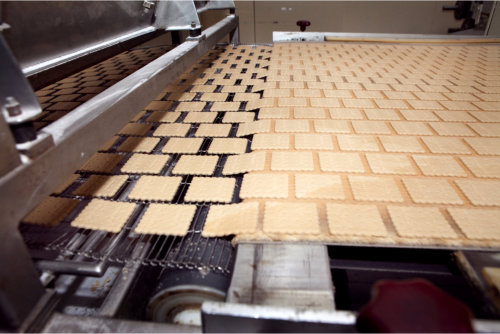 Food hygiene - clean production line with images of crackers into oven